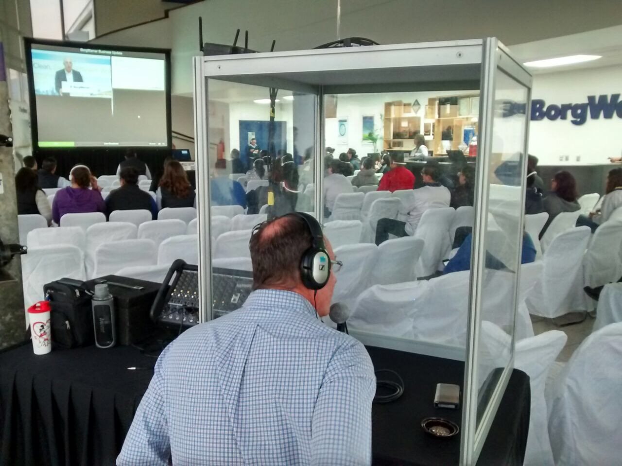 Soundproof simultaneous interpretation booth at corporate event